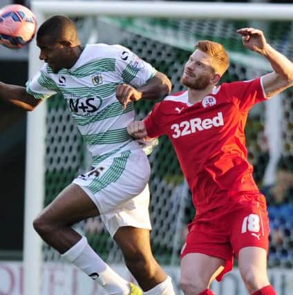 Yeovil Town's Stephen Arthurworrey is tackled by Crawley Town's Matt Harrold PHOTO: - Mandatory by-line: Harry Trump/Pinnacle - Photo Agency Ltd Tel: +44(0)1363 881025 - Mobile:0797 1270 681 - VAT Reg No: 183700120 - 08/11/2014 - FOOTBALL - The FA Cup First Round - Yeovil Town v Crawley Town - Huish Park, Yeovil, Somerset, England. SUS-140911-140145002