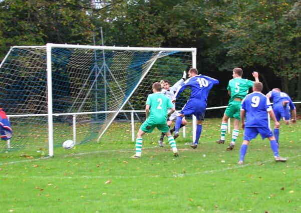 Midhurst find the net against Rustington   Picture by Darren Chiverton