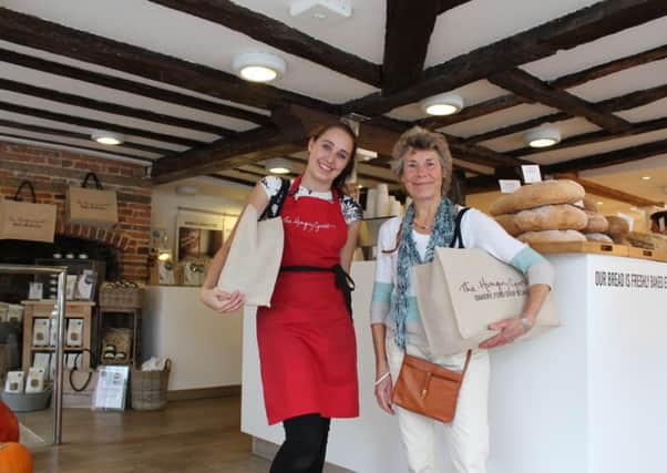 Mrs Sewell picking up her prize at The Hungry Guest, Petworth SUS-141211-154453001