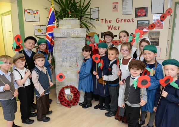 LG 111114 White Meadows Primary Academy, Wick, marking remembrance day, wearing clothes from WW1 for the day. Photo by Derek Martin SUS-141111-154205001