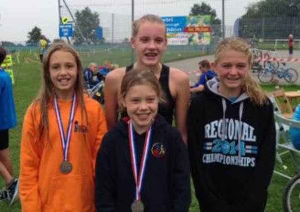 Issy Hayes, Gemma Cumber, Maddy Giller (front) and Amelia Wright SUS-141114-103448001