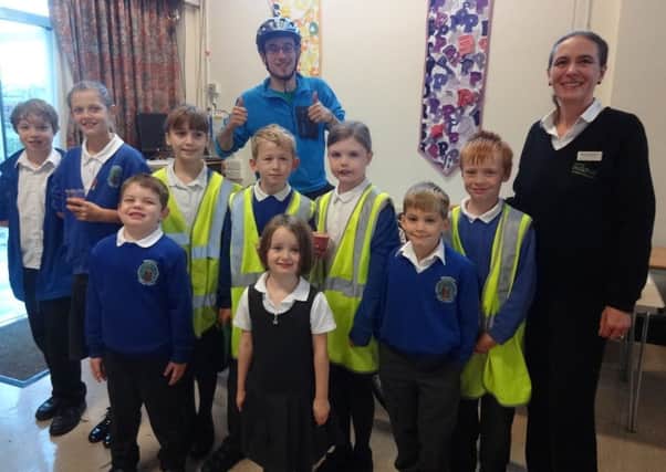 Philip Burroughs from Sustrans with Karen Harrison Services Manager from Kavanagh's Budgens and the Bike It Champions from Billingshurst Primary School SUS-141114-125221001