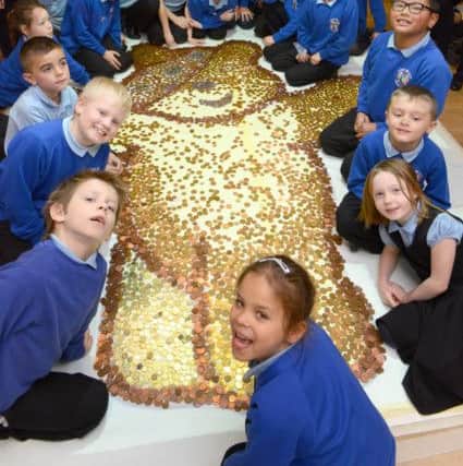 Youngsters at the River Beach Primary School spent the day building a Pudsey from coins D14472087a