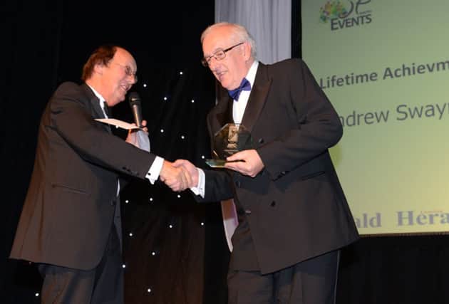 WH 141114 Adur and Worthing Business Awards, 2014. Lifetime Achievment Award,  Andrew Swayne (Adur and Worthing Business Partnership) with host Fred Dinenage. Photo by Derek Martin SUS-141115-201825001