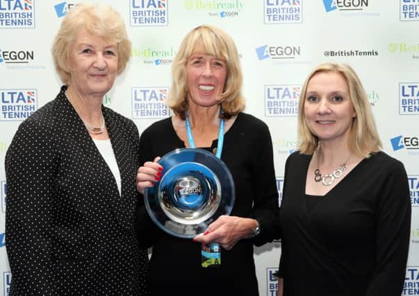 Frances Candy (centre) clutches her award alongside LTA president Cathie Sabin (left) and Aegon UK representative Tara McGregor-Woodhams. Picture courtesy LTA