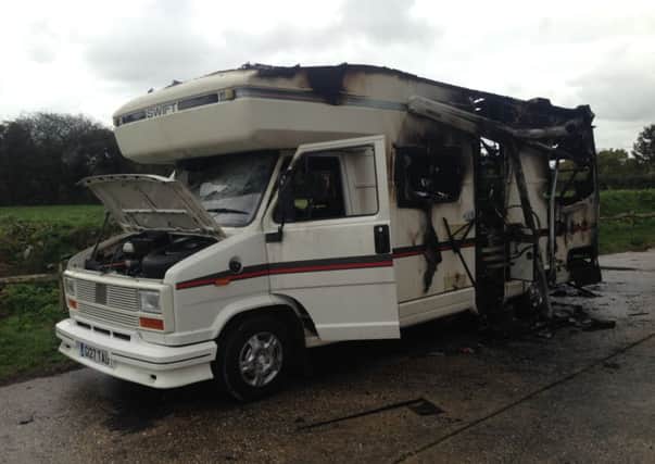 This was what was left of the camper van that Marc Smith and his eight-year-old daughter had been sleeping in. It was attacked by arsonists while the pair were still asleep inside. SUS-141119-092706001
