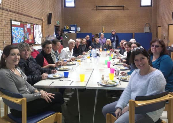 ARK Horsham family sharing a meal at the town's United Reformed Church in Springfield Road