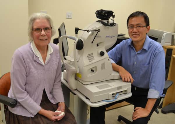 Daphne Moore with Consultant Ophthalmologist Mr Fook Chang Lam who has restored her sight with a new surgery at Worthing Hospital