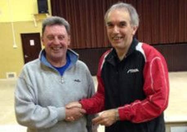 Multiple event winner Dave Butler (right) with Hastings & District Table Tennis Association chairman Andre Keen