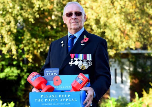 Poppy concern. Derek Moore (Royal British Legion Memeber), who is offering a helping hand to the Royal British Legion in Littlehampton after they announced they were in trouble with this years poppy appeal. Littlehampton. Picture : Liz Pearce. LP281014PO02 SUS-141028-165952008