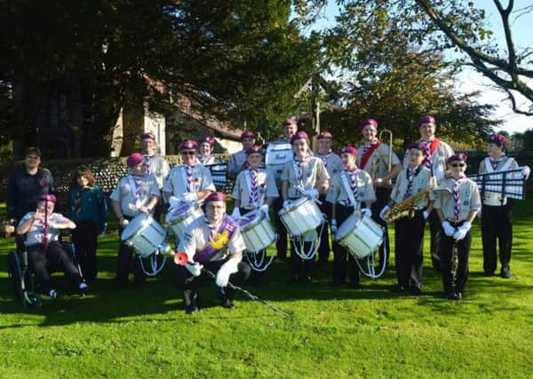 Arundel and District Scout Band celebrate the purchase of their new musical equipment SUS-141120-105402001
