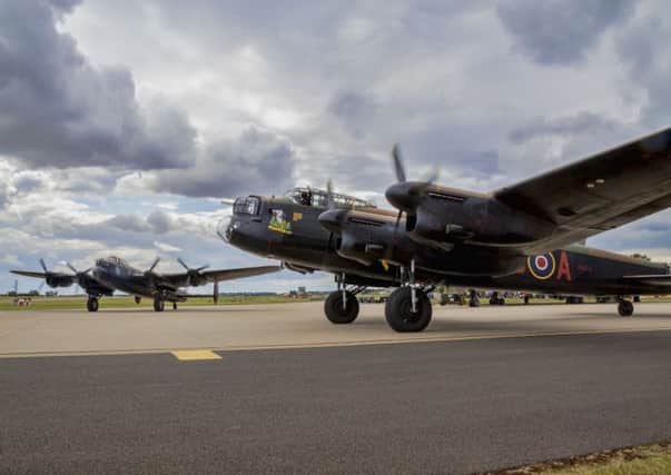 Two Lancaster bombers  similar to those used during the dam busting operation  revving up their engines