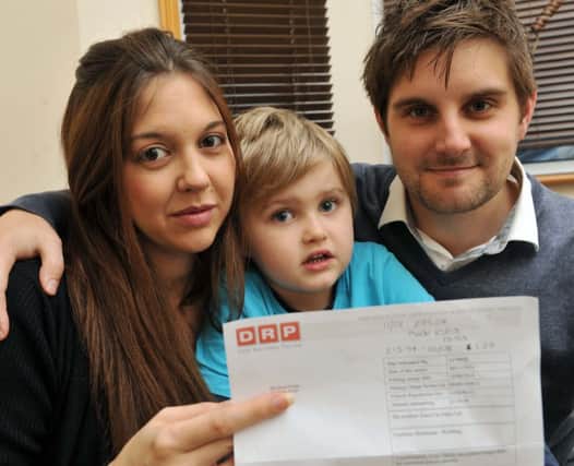 W46533H14

Morrisions Parking Ticket Charlotte and James Fuller and son Lucas with parking ticket from the Debt Company SUS-141113-162746001