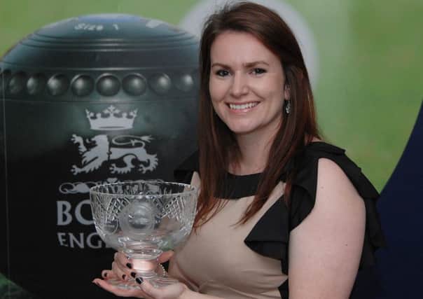 Sian Honnor with the woman bowler of the year trophy