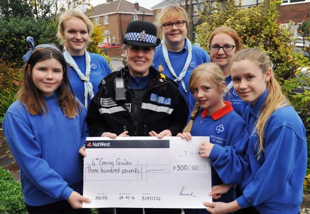 W47602H14

cheque to the 4th goring guides Saturday.  PSCO Carol Fulcher presents the cheque to some of the 4th Goring Guides on Saturday morning SUS-141122-110035001