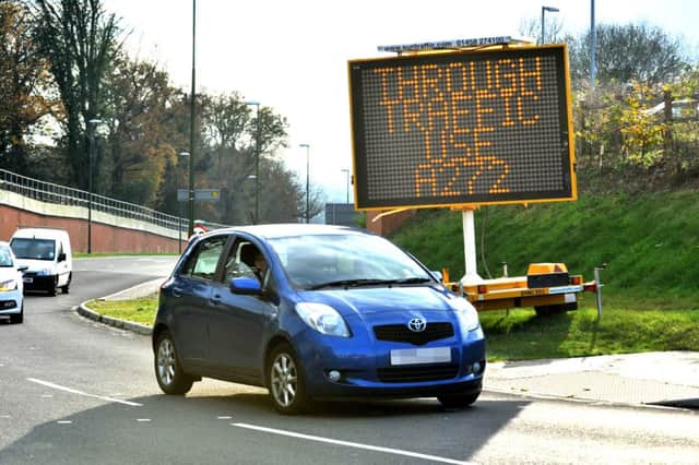 A sign at the Birch Hotel urges drivers on the A272 ro use relief road. Pic Steve Robards SUS-141118-161536001