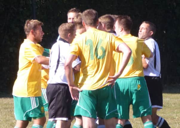 Westfield and Bexhill United get up close and personal during the corresponding fixture last season, which ended in a goalless draw
