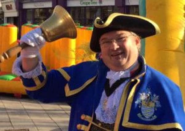 Worthing town crier Bob Smytherman at the Guild Care Christmas Pudding Race SUS-141129-145010001