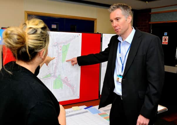 Consultation on traffic and transport issues in Haywards Heath Town Centre at Clair Hall. Iain Steane (Transport Planner WS County Council) in converstaion SUS-140212-152729001