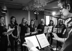 A branch of the Military Wives choir performing while recording Jonny's song SUS-140312-101906001
