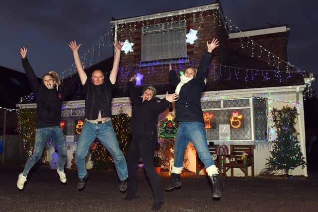 Xmas charity lights. The King family, who have lite their house in Cottingham Avenue to raise money for, "Make a Wish Foundation", for the past 3 years. Pictured are L-R Carrina King (19), Grahame King, Sallyanne King and Carmel King (22).  Horsham. Picture : Liz Pearce. LP051214XLT11 SUS-140512-192831008