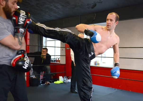 WH 061241 Nick Brewer attempts 100 consecutive rounds of kick-boxing for charity   Photo by Derek Martin