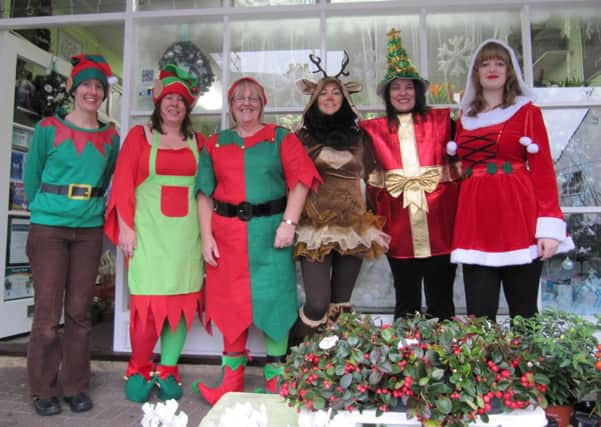 Staff in festive attire at The Flower Shop, in Wick SUS-140912-175017001