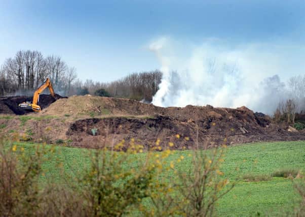 A mound of compost has been burning for days in Titnore LaneD14492655a