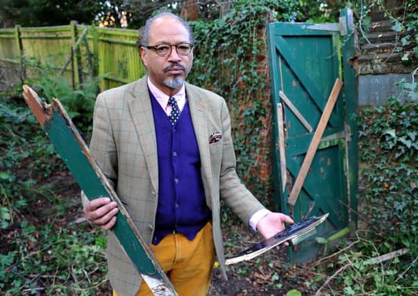 Nigel Allyson-Ryan at Grove Garden Trust community garden, where the gate has been vandalised. Pic Steve Robards SUS-141112-124854001