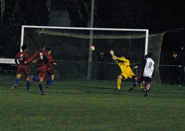 Nick Sullivan goal for YM, Nick Sullivan pictured right (white) tucks it home. Photo by Clive Turner