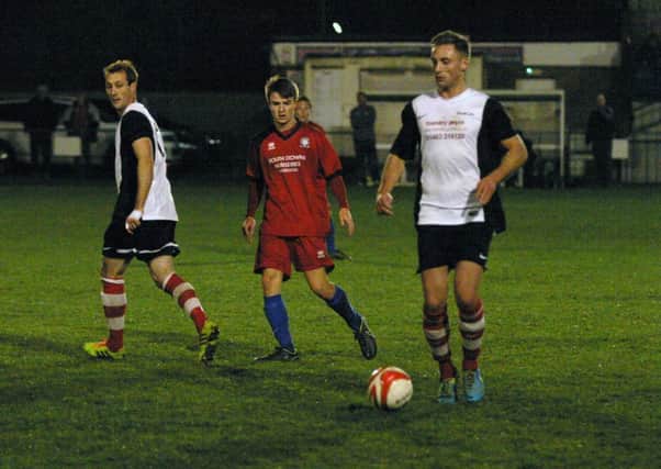Anthony Hibbert (right/white) scored the first goal for YM. Photo by Clive Turner