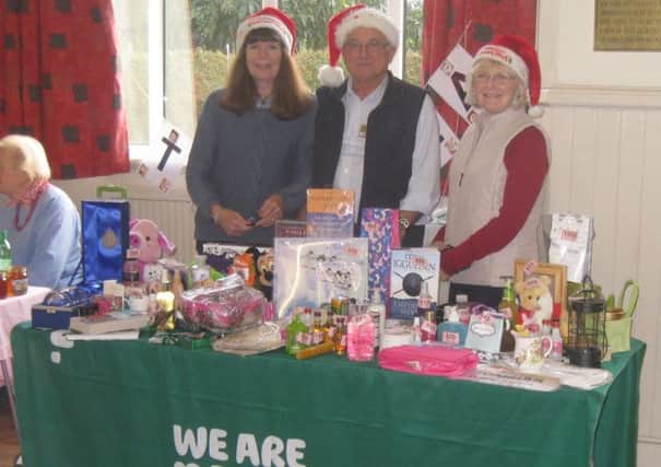 The Tombola stall with (from left to right) Alison Dorsett, Brian Bailey and Dianne Bailey. SUS-141217-101137001