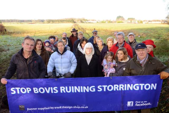 WSCT 161241  Protesters from the Stop Bovis Ruining Storrington Action Group at the western edge of Storrington. Photo by Derek Martin SUS-141216-165247001