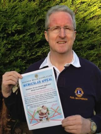 Paul Mcpherson with the Wencelas Appeal poster SUS-141112-083239001