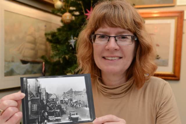Julie Wade with one of the photos she found in the Marlipins Museum archives D14501738a