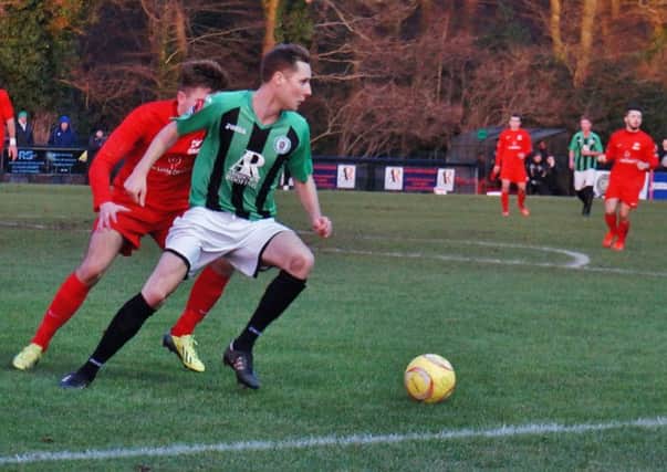 Sam Fisk in action against Carshalton. Picture by Emily Hodgkinson
