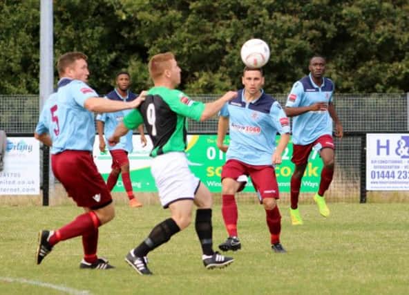 Action from the league meeting between Burgess Hill Town and Hastings United back in August. Picture courtesy Joe Knight