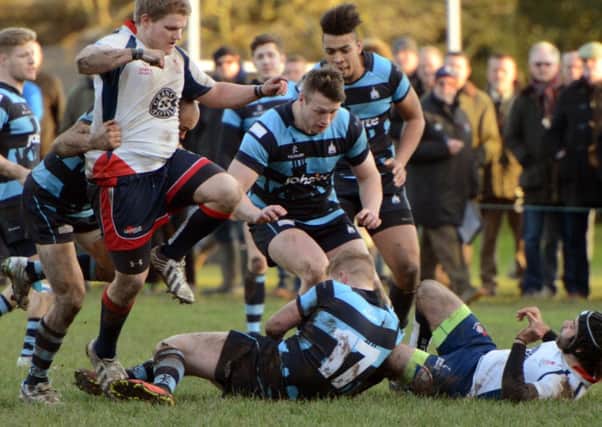 Chichester back Harry Seaman is tackled with Richard Neil in close support  Picture by Derek Martin