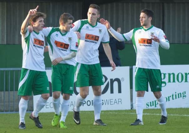 Stuart Green (left of picture) celebrates his goal versus Enfield with his team-mates  Picture by Tommy McMillan