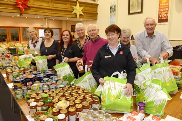 WH 611214 300 Christmas food parcels are being put together for families in need by Worthing Salvation Army. Photo by Derek Martin SUS-141216-165051001