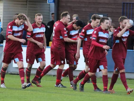 Hastings United celebrate scoring in their 2-0 win away to Herne Bay on Saturday. Picture courtesy Scott White