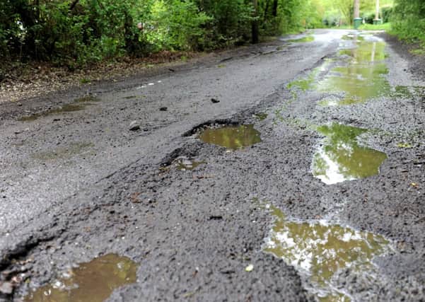 JPCT 110512 Potholes in Emms Lane, ( Brooks Green / Barns Green ). Photo by Derek Martin ENGSUS00120121105124617