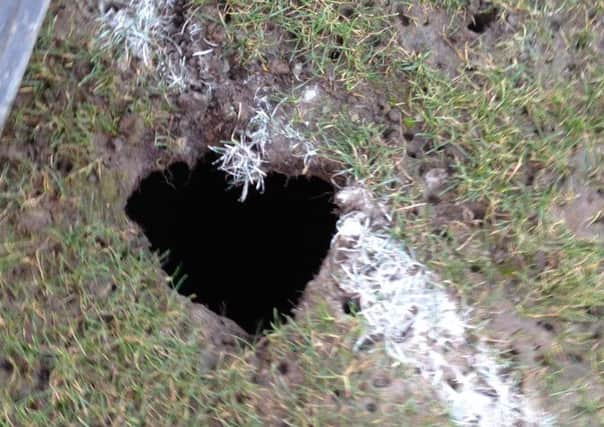 The hole which caused Saturday's game to be abadoned.