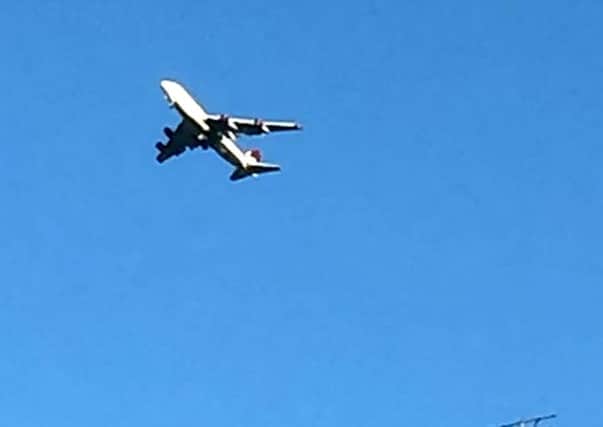 A Virgin 747 is seen circling over Sussex, December 29 2014 after it developed a problem with its landing gear. Initial reports suggest one side of the landing gear is not deployed on the Gatwick to Las Vegas flight. Photo courtesy SWNS.