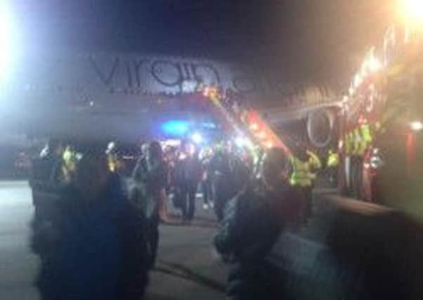 Passengers leave flight VS43. Picture contributed by Cathy Christian