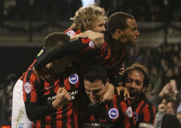 Albion celebrate the first goal in their 2-0 win at Fulham.