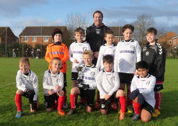 Chichester City Colts under 9s football team looked the part in their new kits as they picked up their first  trophy