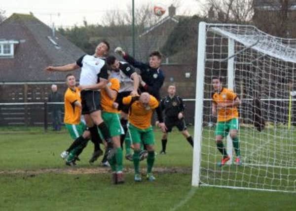 Goalmouth action in Pagham's win over City   Picture by Roger Smith