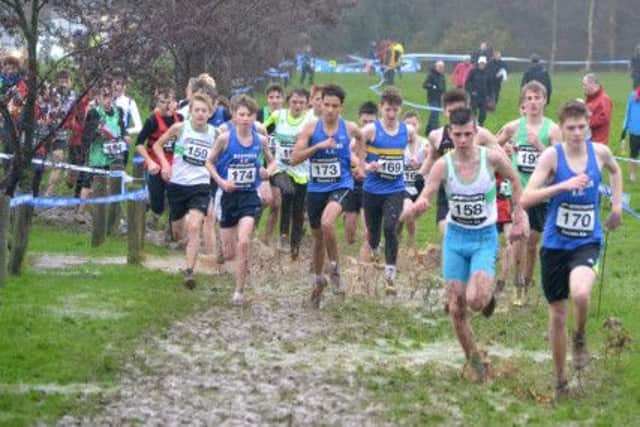 Runners tackle appalling conditions in the Sussex Cross-Country Championships at Bexhill Down on Saturday. Picture courtesy Lee Hollyer
