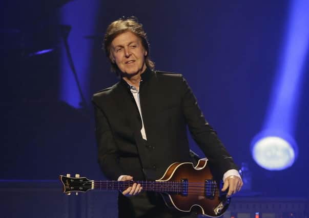 Paul McCartney performs during the first U.S concert of his "Out There" tour, Saturday, May 18, 2013, in Orlando, Fla. (AP Photo/John Raoux) ENGEMN00120130520085636